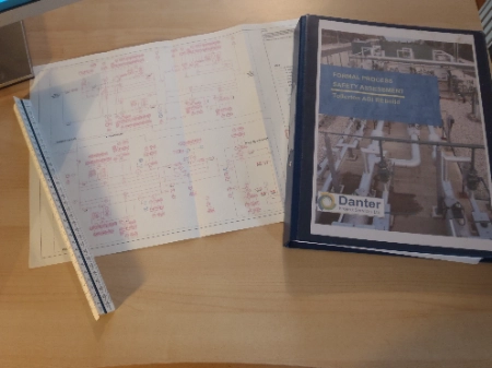 DPS photo of office desk with plans and project folder